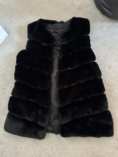 Black faux fur vest with horizontal rows of fur #fauxfur #winter