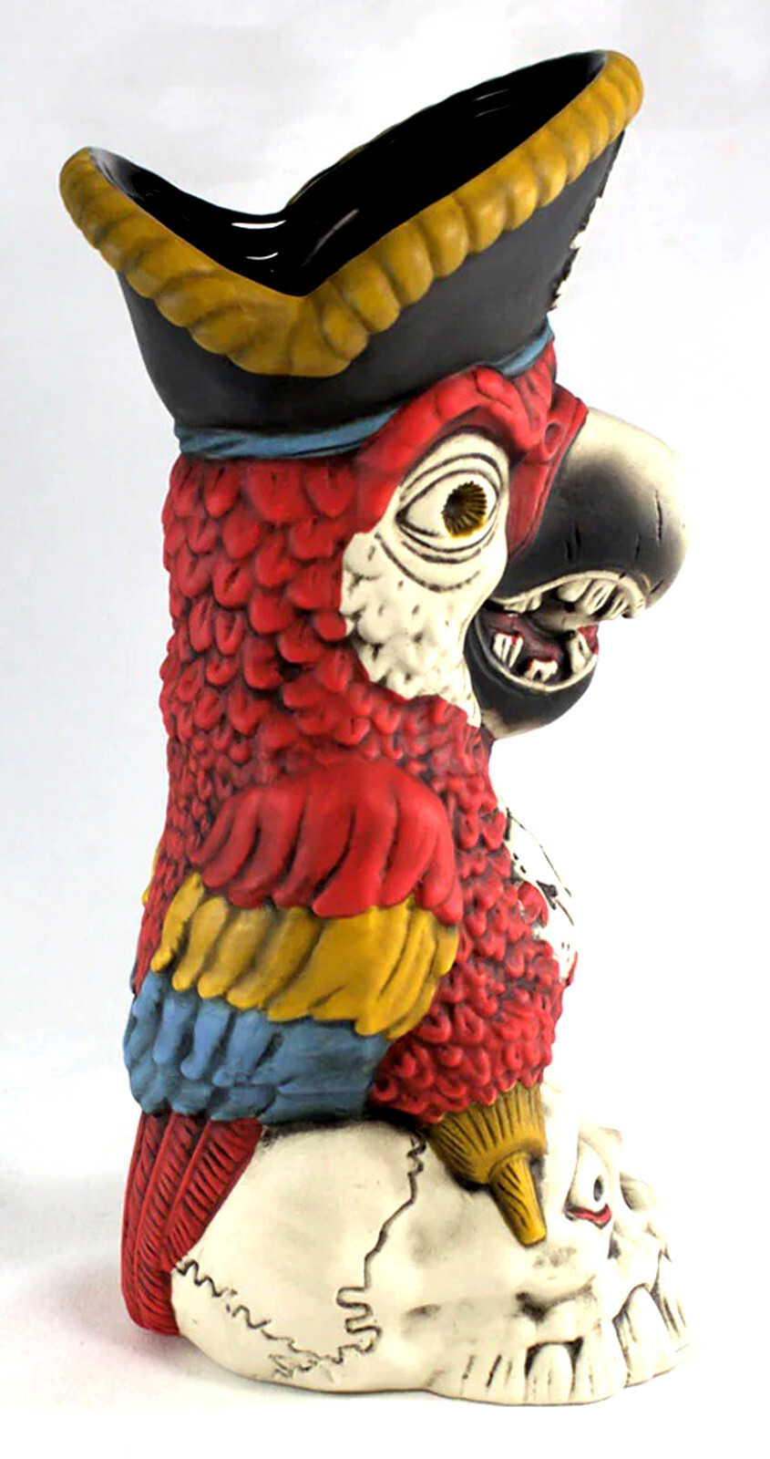 Tiki Farm Peg Leg Pirate Party Parrot sitting atop a Skull Tiki Mug