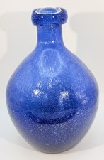 Cobalt blue hand-blown glass vase with speckled texture