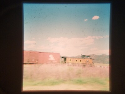 XBB09 35mm Slide Photo Vintage BOXCAR AND CABOOSE IN COUNTRY CLOUDS BLUE SKY
