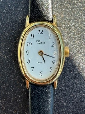 Timex Women's Quartz Oval Dress Wristwatch Gold Black Leather Strap White Dial