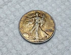 1942  Walking Liberty Half Dollars U.S 90% Silver heavy toning high grade coin !