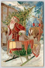Christmas Postcard GERMANY Orange Suit Santa Carries Tree & Toy Sack Green Sled