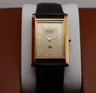 Vintage Seiko Slim Quartz Men's Wrist Watch Beige Dial with Dark Brown Strap.