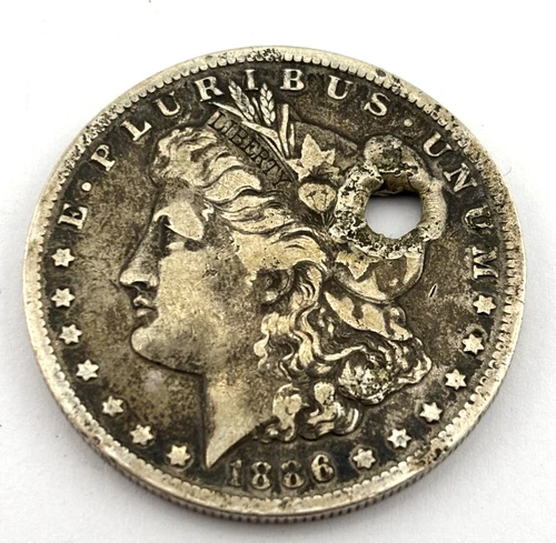 1886 Morgan Silver Dollar with Bullet Hole