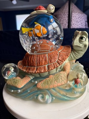 Disney/Pixar Finding Nemo Turtle ride Snowglobe with mini globes.. music& blower