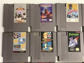 Nintendo NES console bundle with controllers, zapper, and games Tested