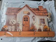 A 2D Wall-Mounted Key Holder Featuring a Cozy Home Highland Terrier Key Rack 