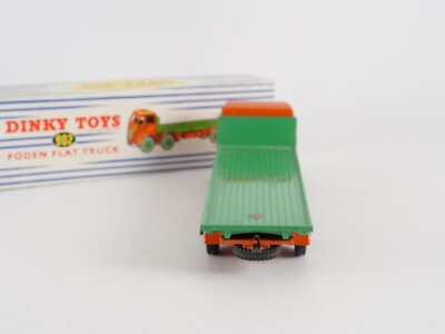 A Dinky Toys No. 902 Foden flat truck, 2nd type cab, finished in orange with mid-green flat bed and