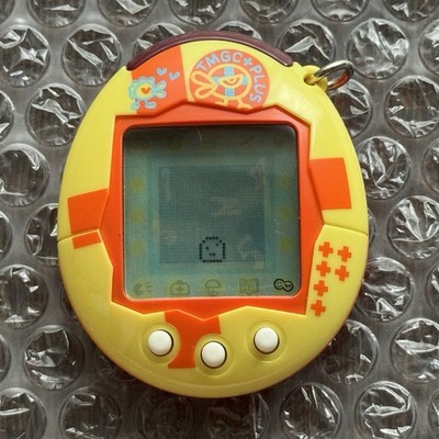 Bandai 2004 Tamagotchi Connection Plus V1 Yellow & Orange Cross