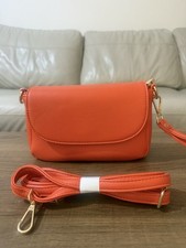 Elegant flap mini shoulder bag in orange colour