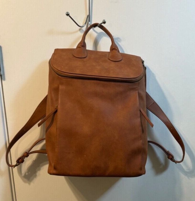 Adult "Unbranded" caramel leather backpack with side zippers. Pre. Owned