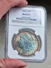 1884 O MORGAN SILVER DOLLAR NGC MS63 PLUS STAR GRADE. EXCEPTIONAL TONING!