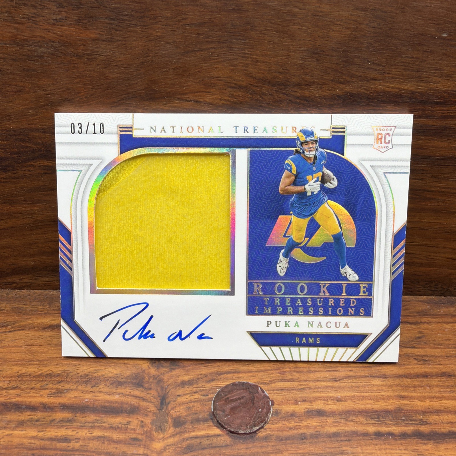 2023 National Treasures - Rookie Treasured Impressions Puka Nacua Holo Gold /10