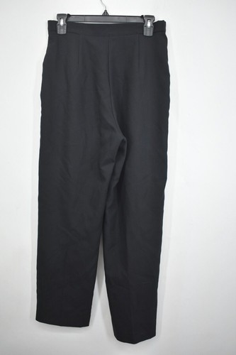 Black women's straight-leg pants with front pleats, side pockets, and belt loops, hanging on a black hanger.