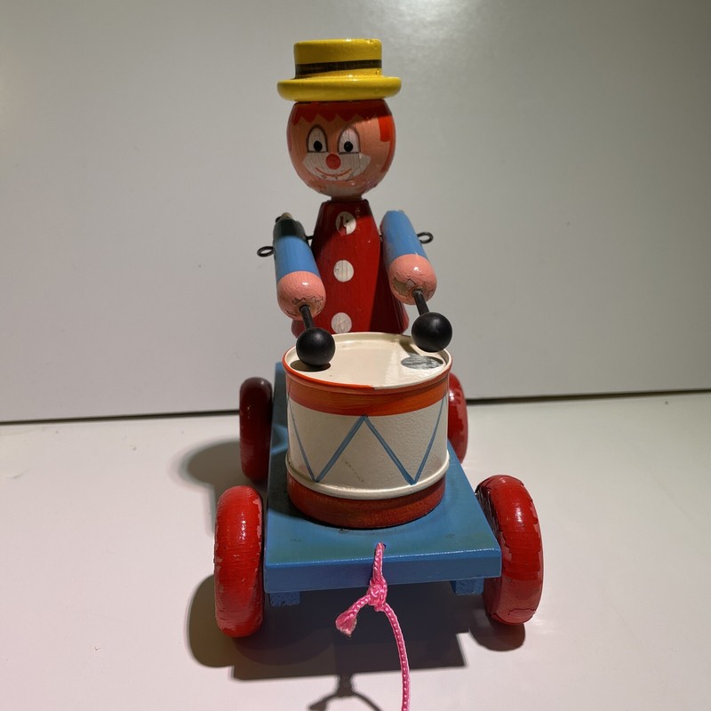 Wooden clown drumer pull toy.