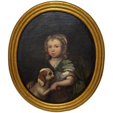 An Endearing Bond Boy with King Charles Spaniel Puppy Circle Of Mary Beale C1680