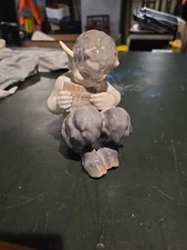 Royal Copenhagen figure Faun Playing Syrinx / Pipes, no. 1736, executed in 1939