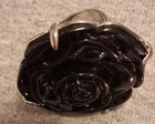 A vintage Avon sterling silver ring featuring a large black flower design