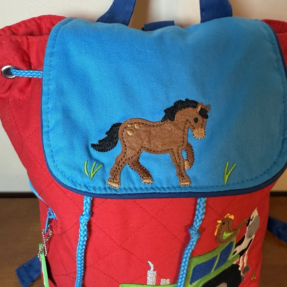 Mochila acolchada para niños Stephen Joseph animales de granja roja y azul Foto 2 de 4
