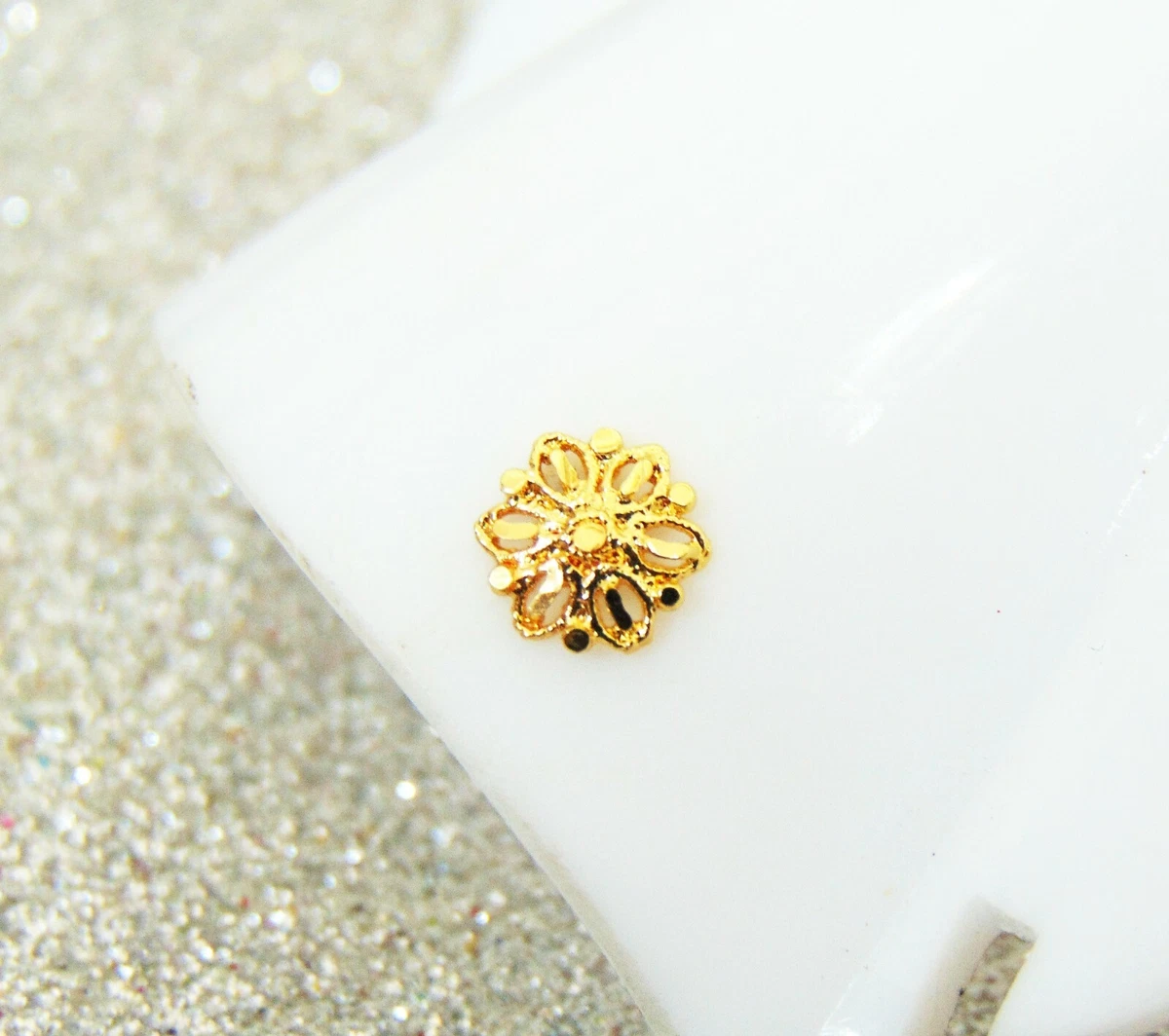 Traditional gold hotsell nose pin