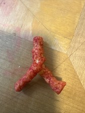 Hot Cheetos Figure Looking Like Beetles Crossing The Road