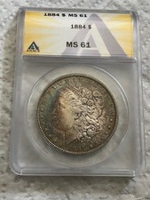 1884 SILVER MORGAN DOLLAR ANACS MS61 - RAINBOW TONED