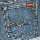 Blue stretch denim shorts, size 32, with back pocket featuring yellow stitched line and red “7 For All Mankind” patch.