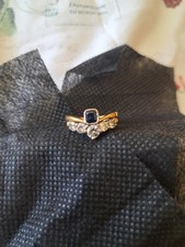 Wishbone Shape Ring: Set with a 4.8 x 4.4mm Oblong Faceted Sapphire & 5 Diamonds