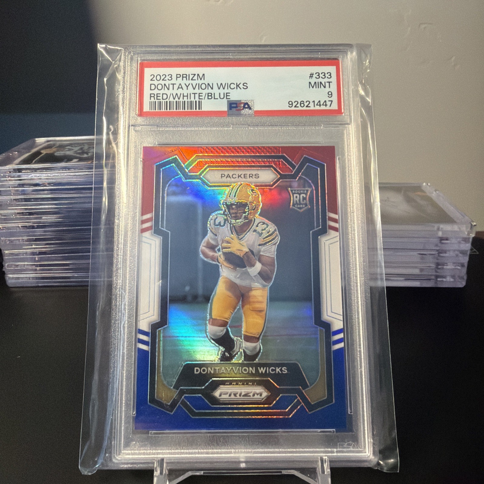 2023 Panini Prizm #333 Dontayvion Wicks Red/White/Blue PSA 9 Green Bay Packers