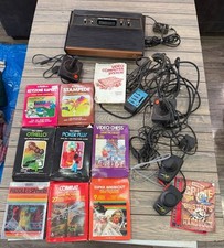 Atari 2600 Console Bundle W/ 8 Games Controll...