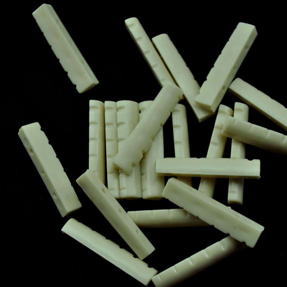 Lote de 50 piezas Guitarra Acústica Tuercas Ranuradas Sillines Superiores Puente Blanco Marfil