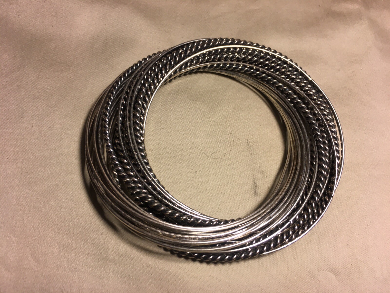 Silver Tone Intertwined Multiple Bangle Bracelets - image 5