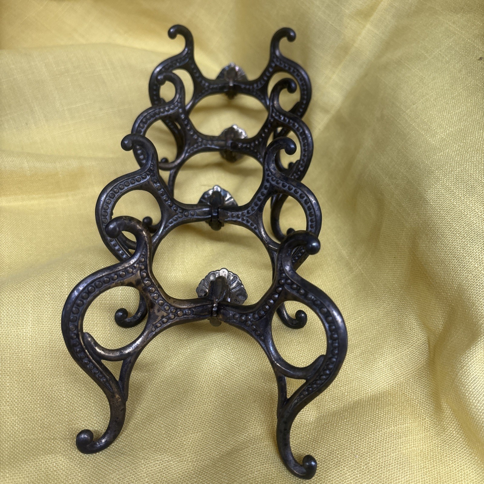 4 antique Victorian or Eastlake style cast iron dual coat hooks