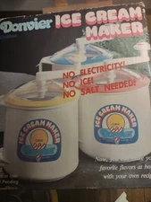 Vintage Donvier Quart Size Premier Ice Cream Maker yellow with recipe book.