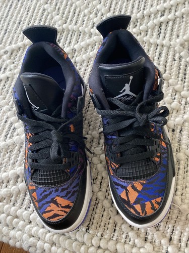 black blue and orange jordan 4s