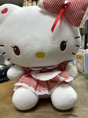 Hello kitty in dress  approximately (15 inches tall & 10 inches wide)