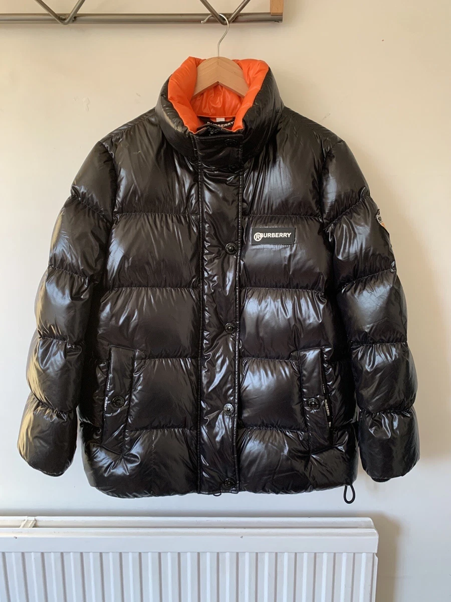 Black puffer jacket store with orange lining