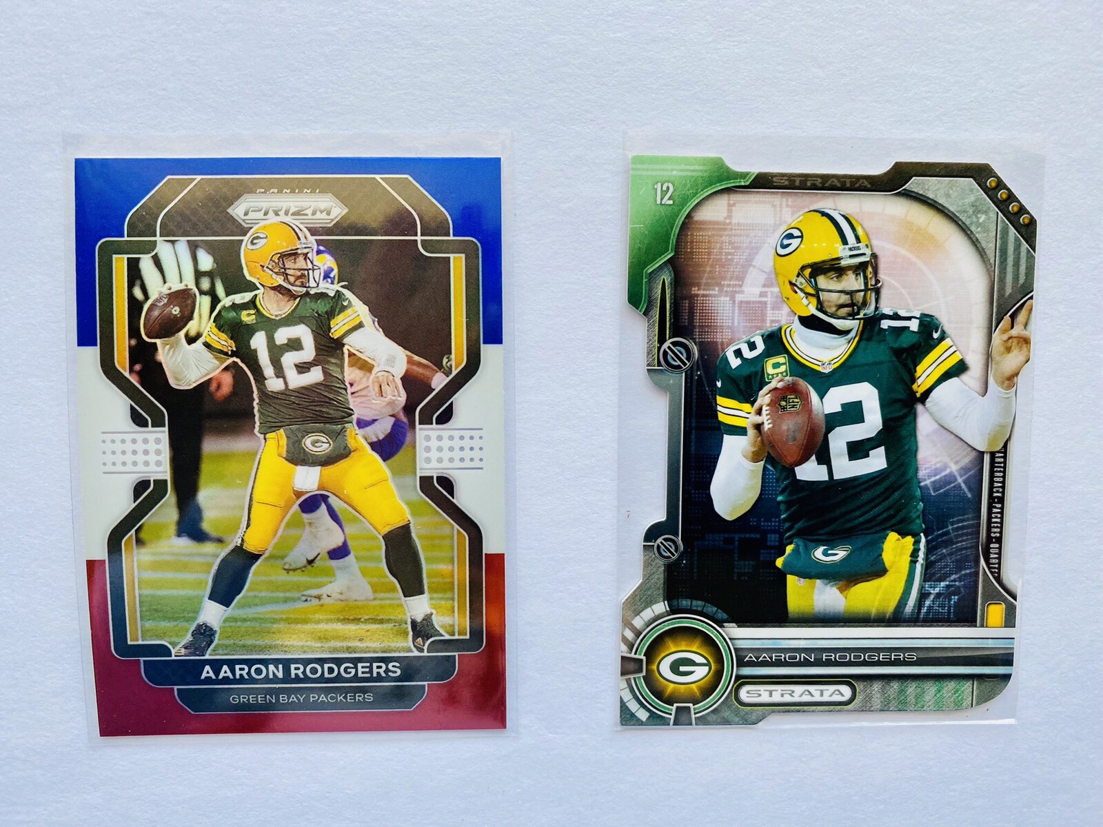 AARON RODGERS 2021 PRIZM Red White Blue PRIZM + 2014 Strata DIECUT Packers