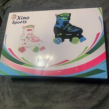 Xino Sports kids adjustable size M 1-4 roller skates Pink