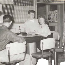 Vintage Snapshot Photo Men Women Sit At Bar Lounge 7 Up Advertisement 1950s 60s