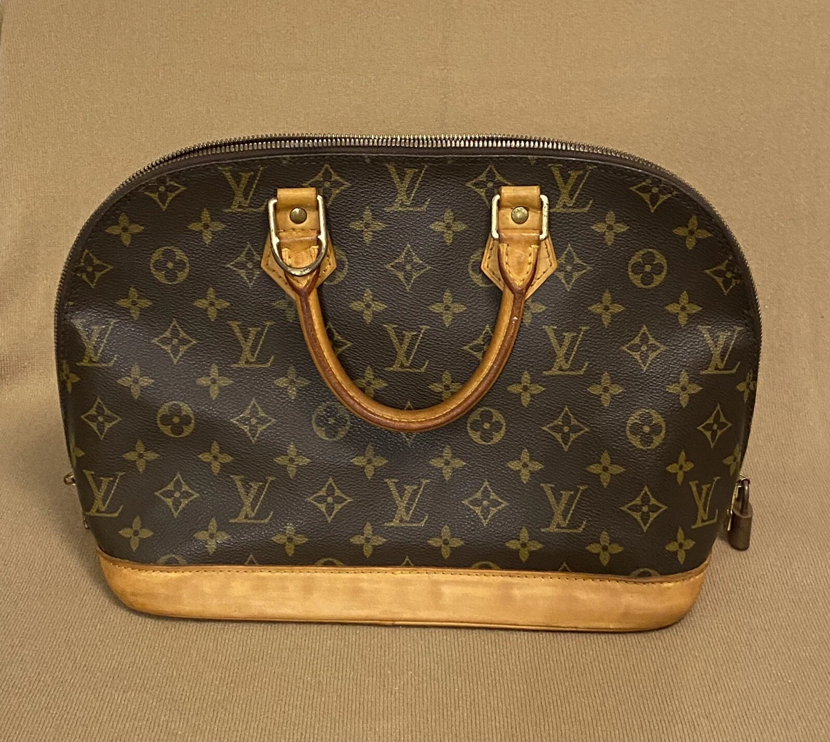 louis vuitton purse with lock and key