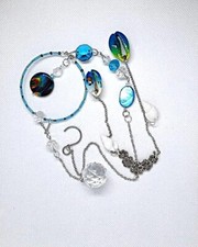 Pretty beach theme sun catcher with shells and crystals painted shell medallion
