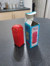 A Red Miniature Die Cast Telephone Box Pencil Sharpener With Door
