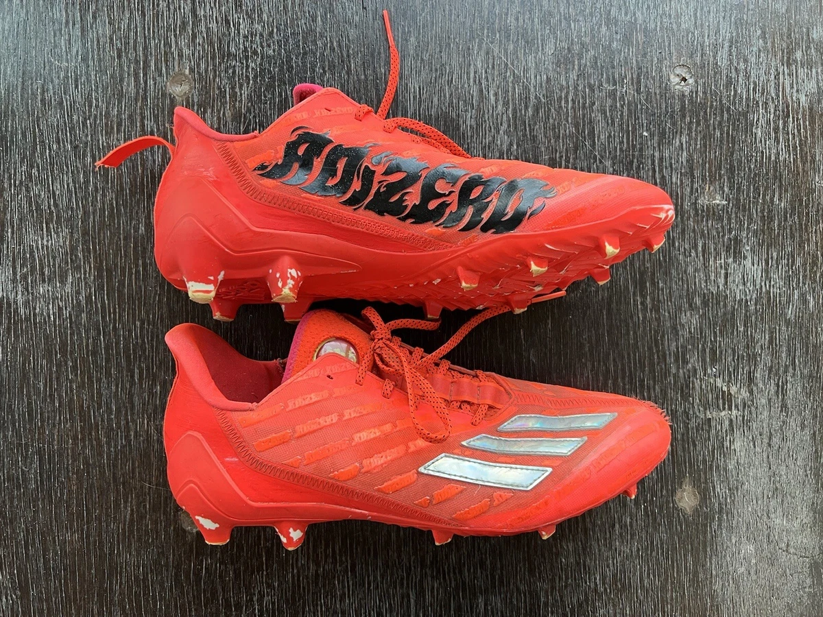All red adidas football cleats top