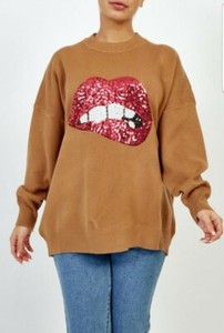 red jumper with sequin lips