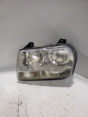 Used Left Headlight Assembly fits: 2005 Chrysler 300 halogen w/o projector Left