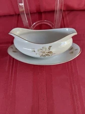 MEITO CHINA  OVAL GRAVY BOAT WITH ATTACHED UNDERPLATE 9" W 2 1/8D MADE IN JAPAN.
