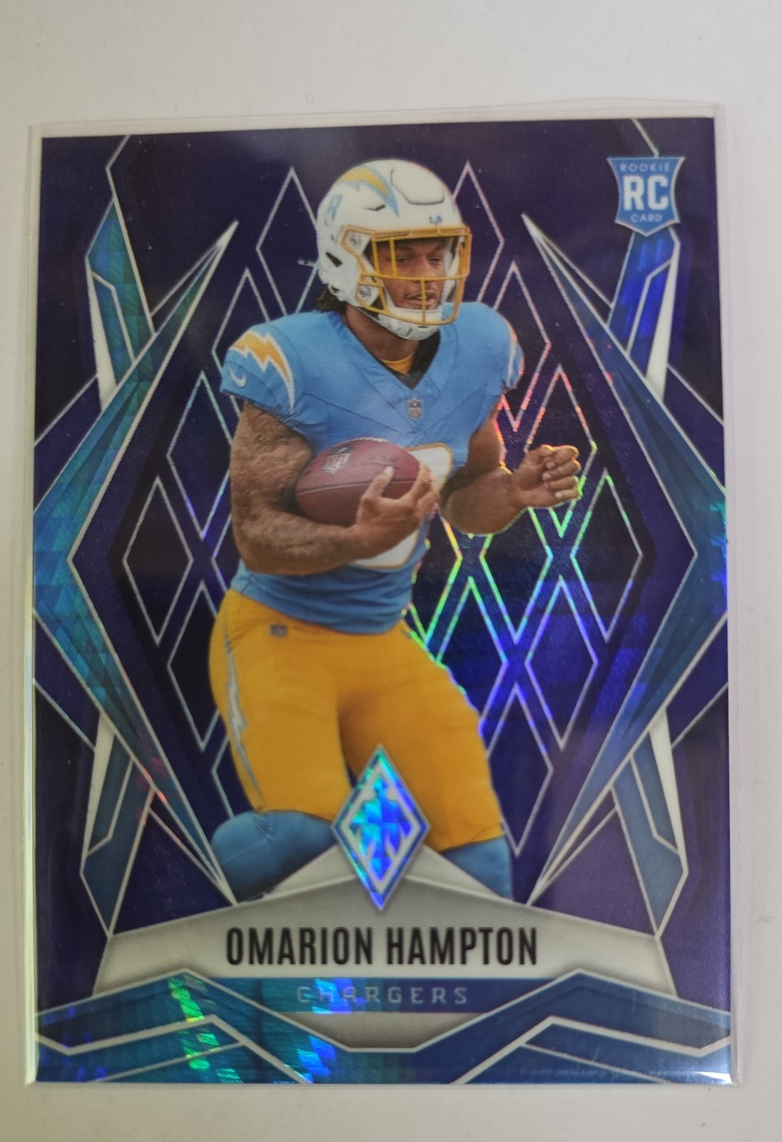 2025 Panini Phoenix - Rookies Omarion Hampton #192 Blue Hyper /199 (RC)