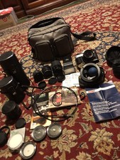 Canon AE-1 35mm SLR Film Camera Pkg PLUS 3 Additional Lenses   PLus all assories